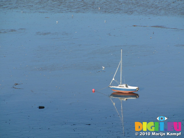 SX11924 Beached sailboat on Swansea Bay mud sands